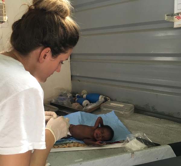 (Photo courtesy Doctors Without Borders) Utah midwife Kirsti Rinne treats an infant at a hosptial near the South Sudan village of Lankien. She just returned from a three-month stint as director of a 24-bed maternity unit near the war zone.