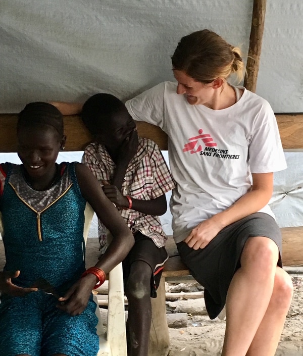 (Photo courtesy Doctors Without Borders) Kirsti Rinne jokes with some villagers during a break from her duties as director of a 24-bed maternity ward at the Doctors Without Borders hospital in the village of Lienkien in South Sudan.