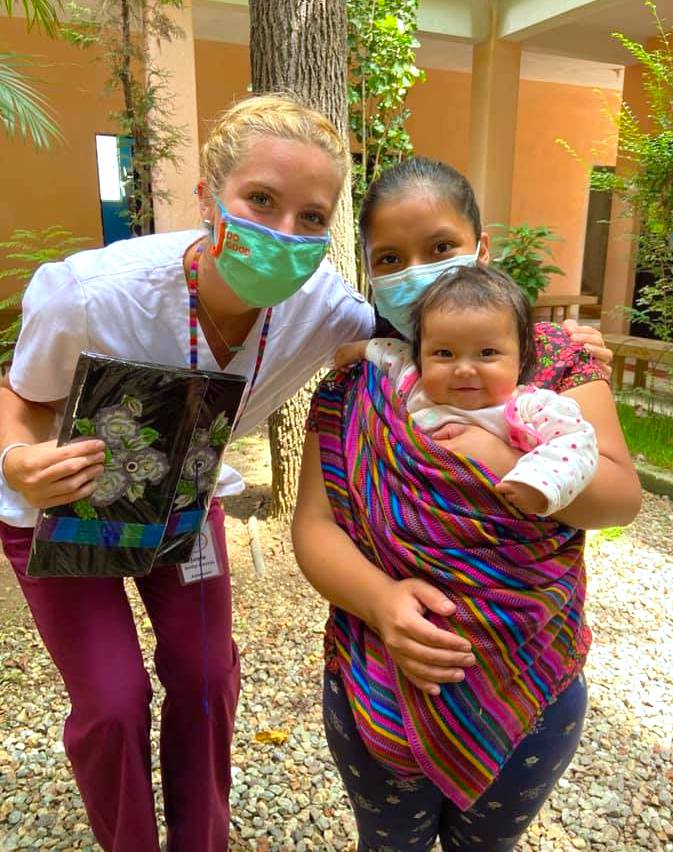 Kim Garcia daughter poses with Guatemalan woman and baby