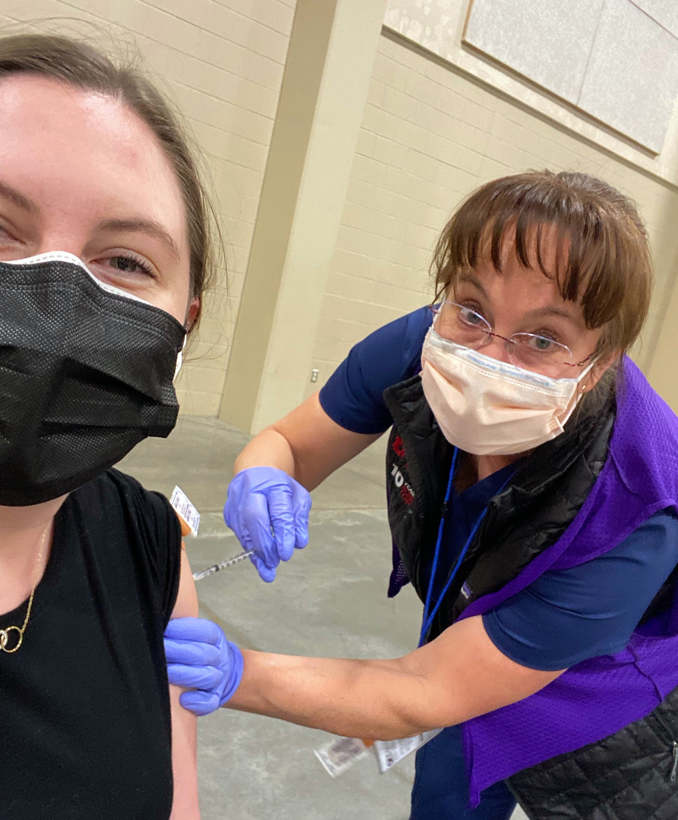 Katie Ward vaccinating daughter