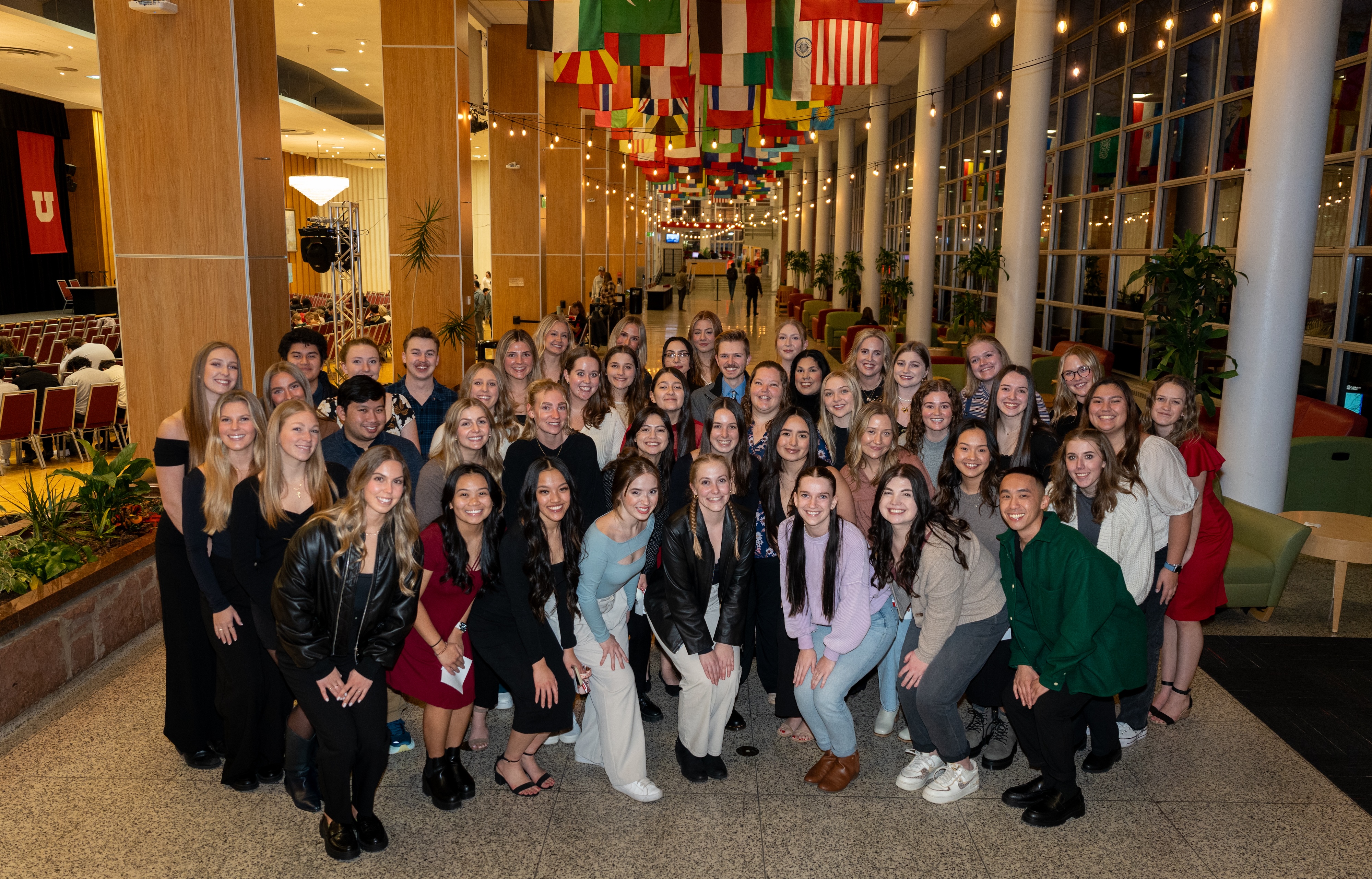 59 students pose for a group photo in the hallway of the University of Utah Union Building