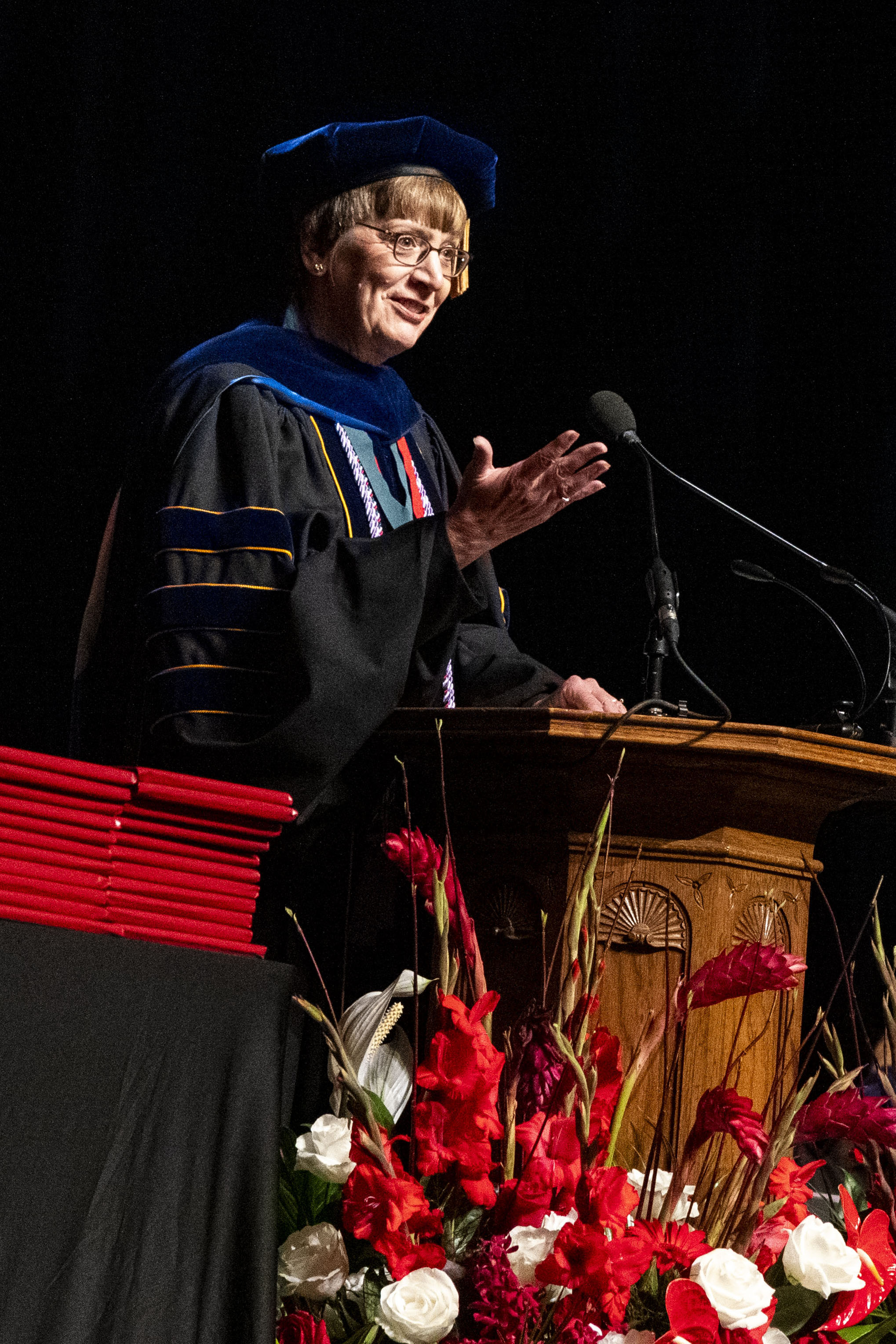 Dean Marla De Jong speaks from the podium